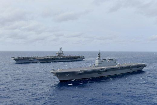 SOUTH CHINA SEA (June 11, 2019) The Navy's forward-deployed aircraft carrier USS Ronald Reagan (CVN 76), left, operates with the Japan Maritime Self-Defense Force (JMSDF) helicopter destroyer JS Izumo (DDH 183), June 11, 2019. The ships, along with the JMSDF destroyers JS Murasame (DD 101) and JS Akebono (DD 108) conducted communication checks, tactical maneuvering drills and liaison officer exchanges, June 10-12, designed to address common maritime security priorities and enhance interoperability at sea. (U.S. Navy photo courtesy of JMSDF/Released)