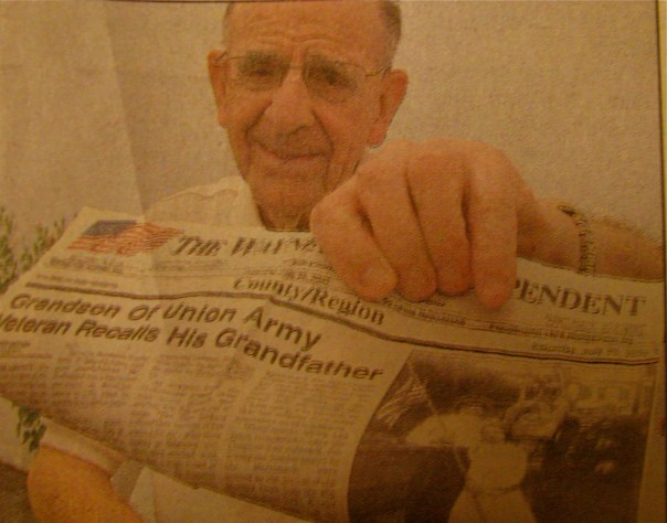 Frank Hochstetter, of Englewood, Fla. holds a newspaper story showing him and his grandfather Franz Baumann, a Civil War veteran. Photo provided by Frank Hochesteter